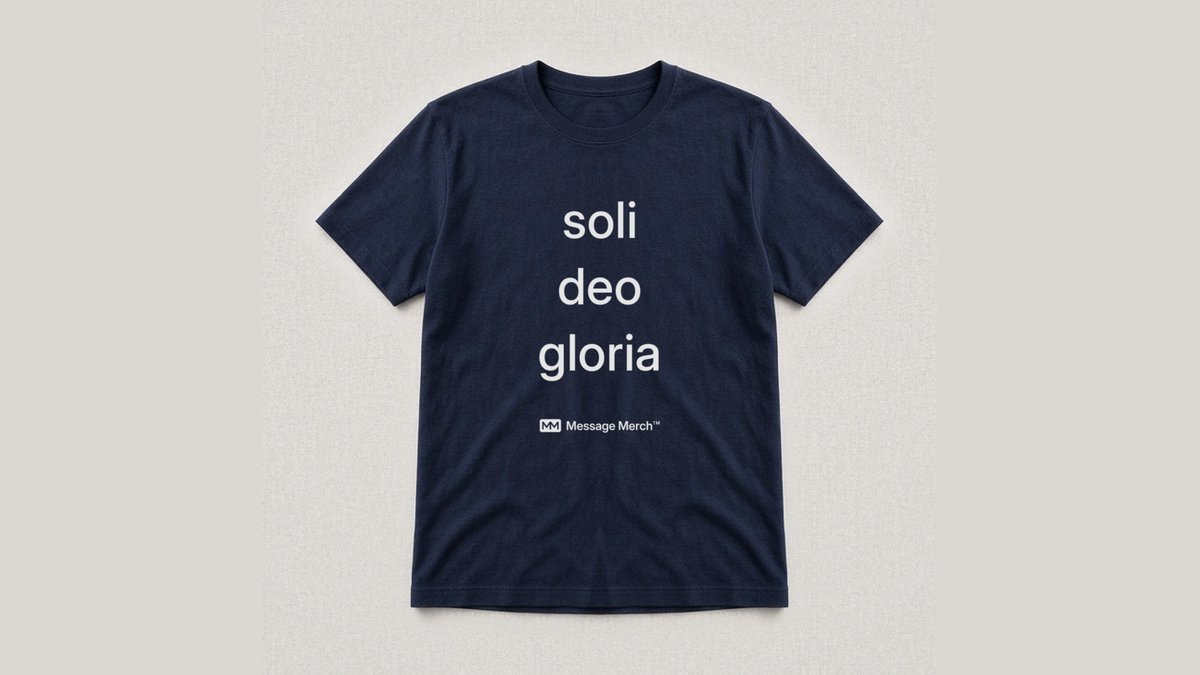 Navy shirt printed with soli deo gloria, with a small Message Merch logo under the words
